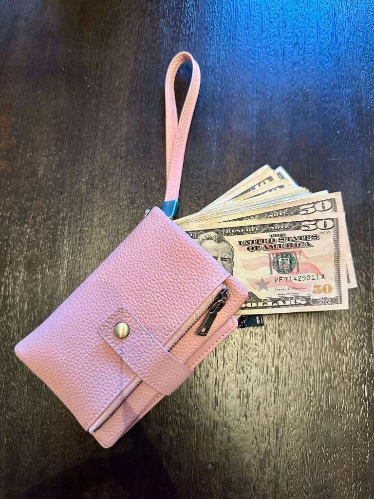 wallet with money coming out