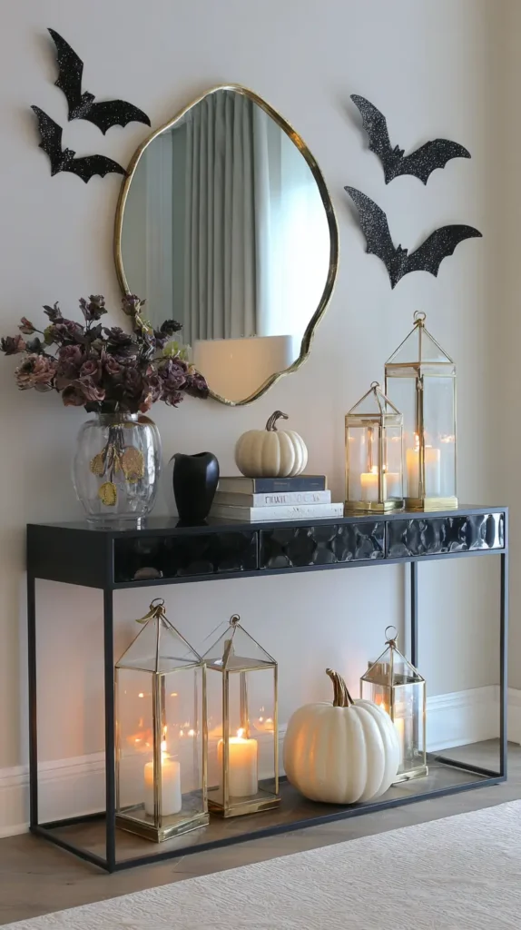 side table, bats on the wall, pumpkin and lanterns