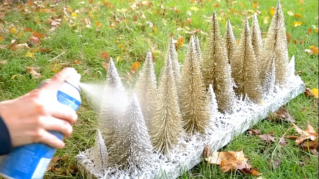 spray the bottle brush centerpiece with faux white snow