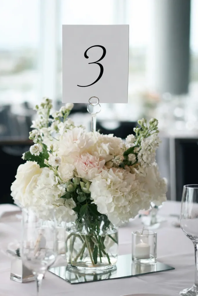 minimalist wedding table decor, floral arrangement with number 3