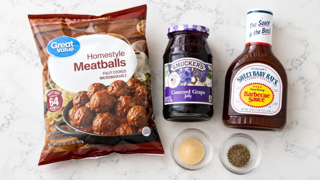 Frozen Great Value meatballs, Smuckers grape jelly, Sweet Baby Ray's barbecue sauce, garlic powder, and black pepper arranged on marble countertop